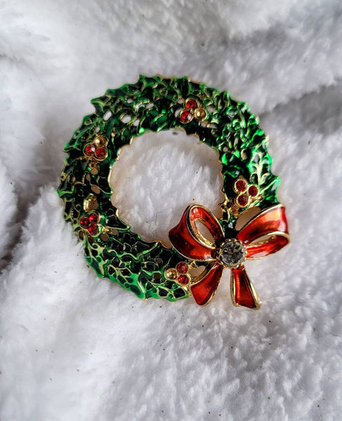 Red Ribbon Wreath in a Vintage Goldtone setting.