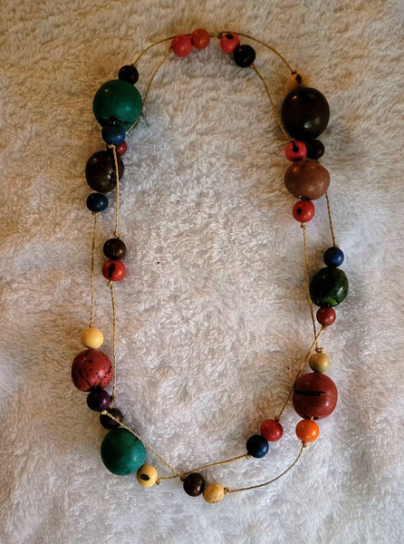 Enter The Woods Collection. Top Left Suspended Wooden Gumballs Small and Large Wood Beads...Necklace