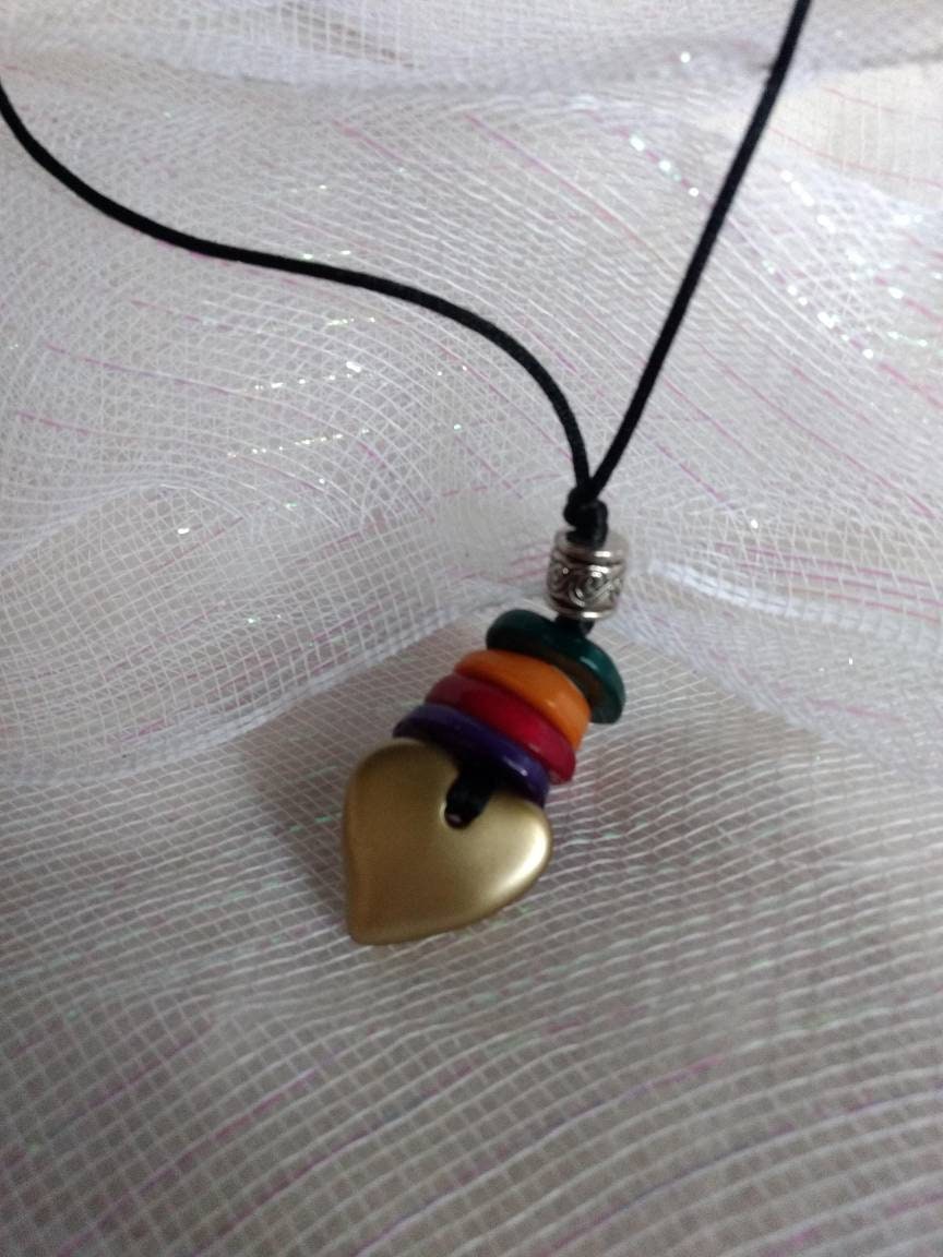 Brushed Geart with Muti Color Lucite Disc on Leatherette 20 inches The Heart Feature is 4 more inches