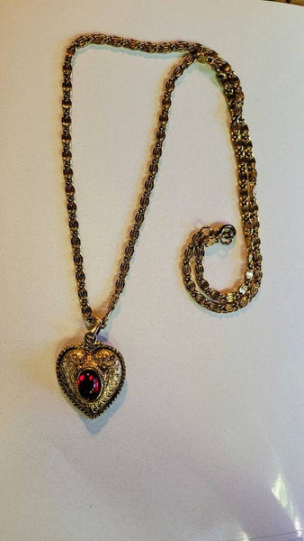 SOLD...Vintage Valentines Exquisite Gold Scrooled Heart Pendant  Center with Ruby Red Oval Rhinestone. The Chain is ornate interlocking Gold