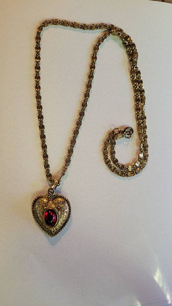 SOLD...Vintage Valentines Exquisite Gold Scrooled Heart Pendant  Center with Ruby Red Oval Rhinestone. The Chain is ornate interlocking Gold
