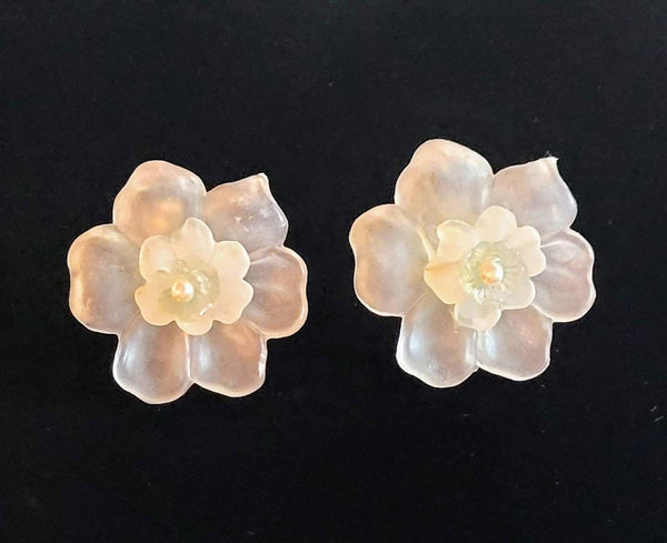 Frosted Iluminating Flower Earrings.  Fifties Plastics Pearl center.  Fantastic material allows color light Illuminating a Amazing Soft Glow