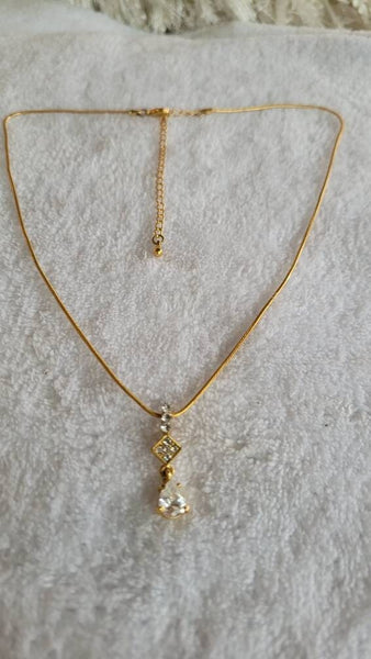 Dazzling Diamante Necklace Feature Pronged Crystal  Rhinestones on Gold.