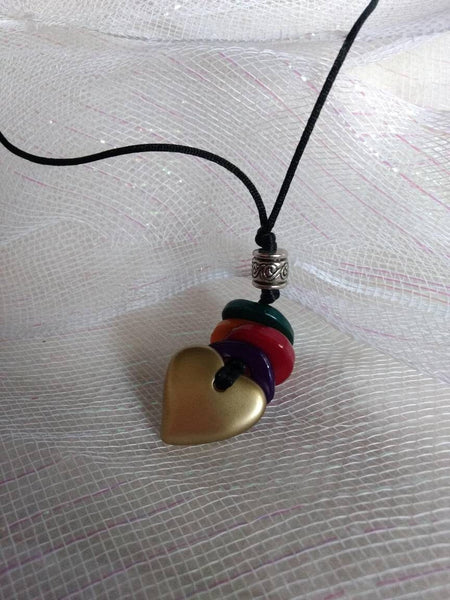 Brushed Geart with Muti Color Lucite Disc on Leatherette 20 inches The Heart Feature is 4 more inches