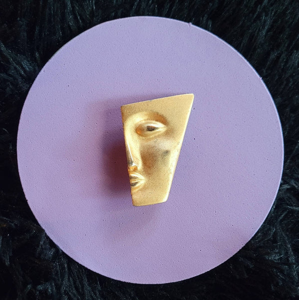 Faces Collection Brooch "My Better Half " is done on Soft Brushed Gold with Polished  Highlights  Features A Senual Sleek Sophisticated Face