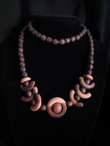 Finely Tooled Natural Wood Geometric Necklace...