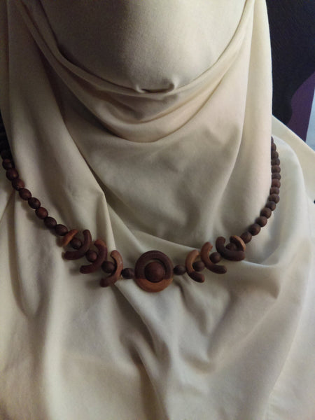 Finely Tooled Natural Wood Geometric Necklace...